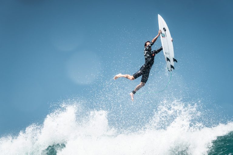 surfer falling on wave