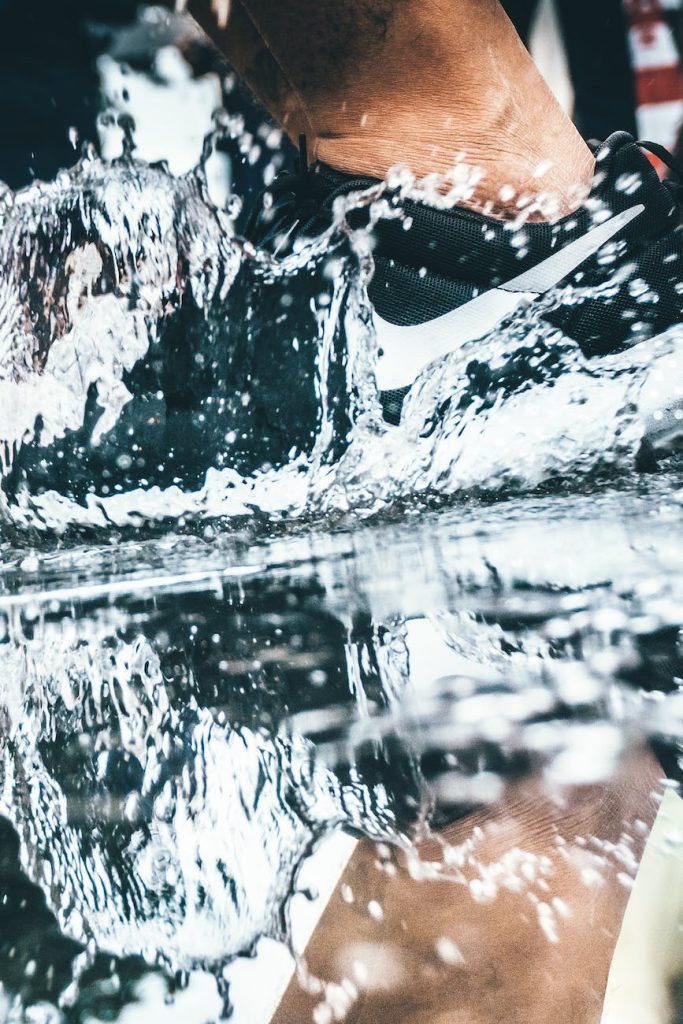 close up low section of man in water