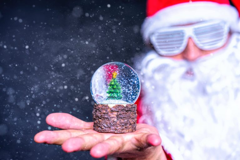 shallow focus photo of crystal ball on person s hand