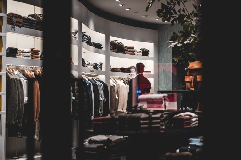 anonymous stylish man during shopping in fashion store