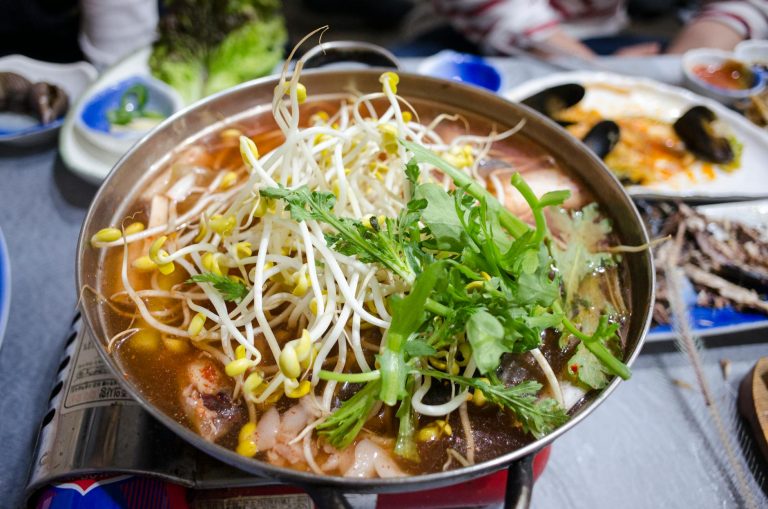 vegetables in a casserole cooking on portable stove