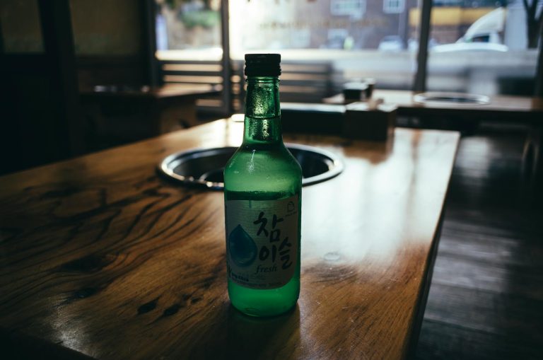 a close up shot of a bottle of soju